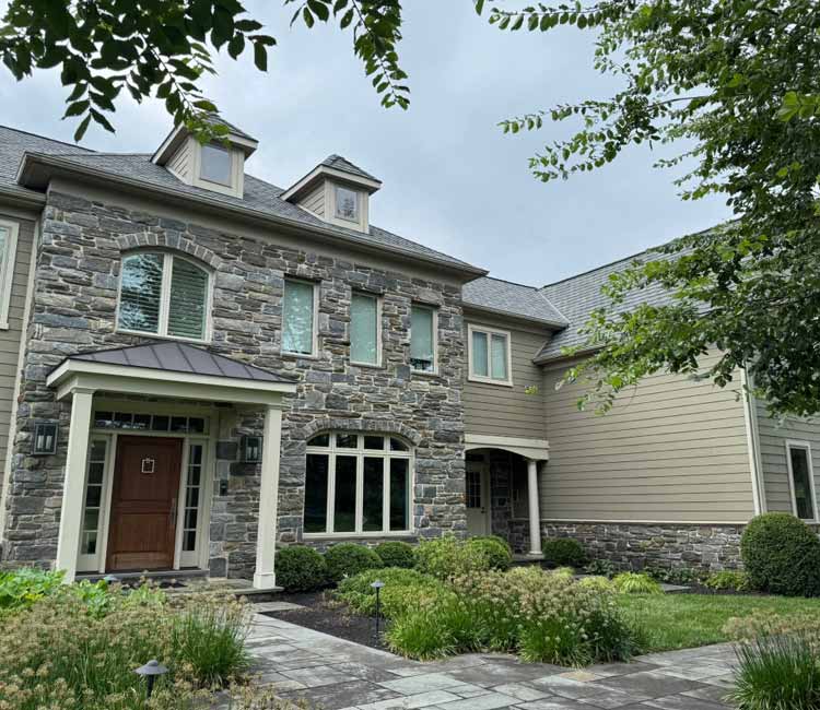 Residential home with stone siding